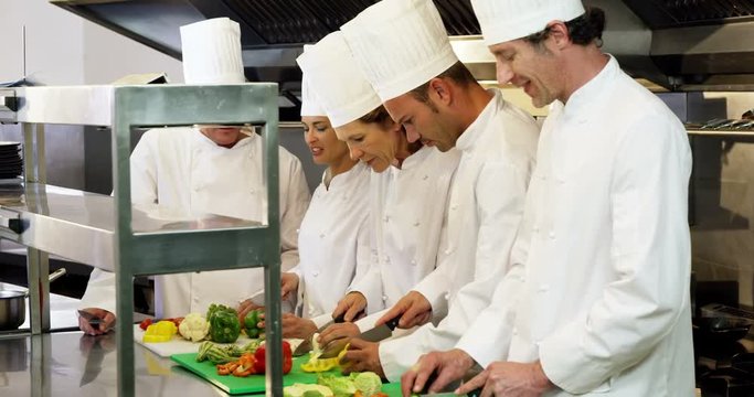 Cook gourmets preparing a salad