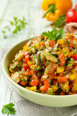 Grilled vegetables salad with yellow and red bell pepper, eggpla