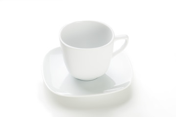 Empty white mug on white background