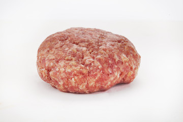 Raw beef burgers against white