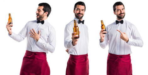 Waiter holding a beer
