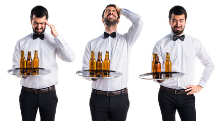 frustrated waiter with beer bottles on the tray