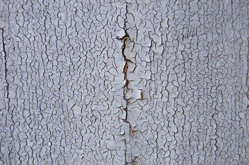 Old cracked paint pattern on wooden background. Peeling paint. 