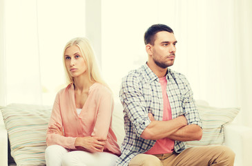 unhappy couple having argument at home