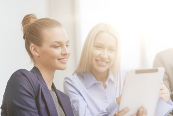 business team with tablet pc having discussion