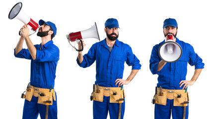 Fototapeta premium Plumber shouting by megaphone
