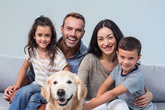Family With Dog In Living Room