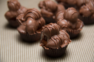 chocolate macadamia nut fudge against background.