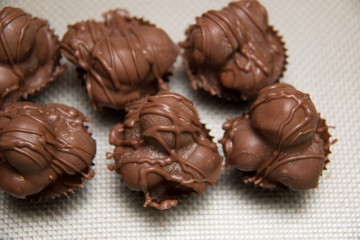  chocolate macadamia nut fudge against background.