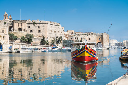 Traditionally painted passenger boat in Vittoriosa