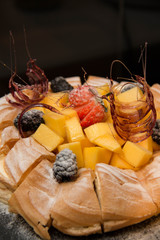 Profiteroles with fresh mango