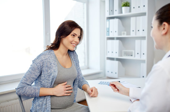 Gynecologist Doctor And Pregnant Woman At Hospital