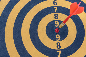 Dart target with arrow on bullseye, Goal target success business investment financial strategy concept, abstract background