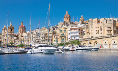 Fototapeta na wymiar Sailing boats on Senglea marina in Grand Bay, Valetta, Malta