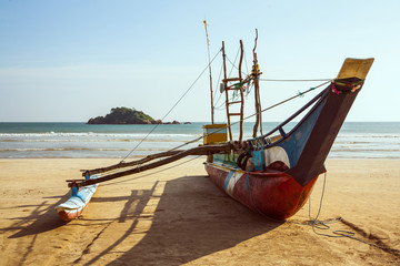 Traditional fishing boat on the beach of Weligama