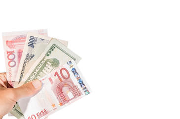 Ten euro banknote on hand with other currencies