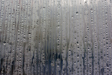 fabulous water droplets on the wall polycarbonate backlit dramatically lit by the sun. different color settings. finishing in the space lab. for interesting ideas. for background.