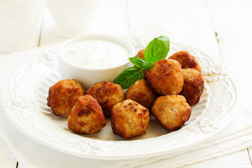 Homemade meatballs with cream sauce.