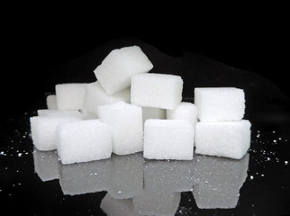 Sugar cubes on black background. Low key close-up.