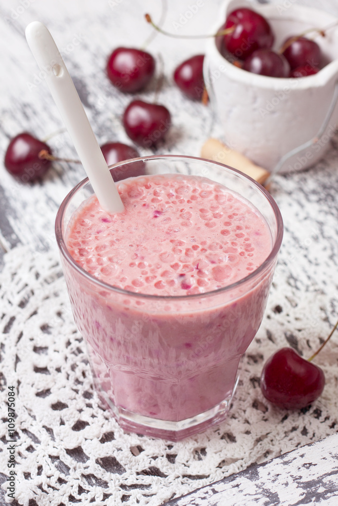 Poster smoothie with cherry in a glass