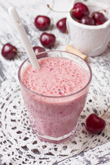 smoothie with cherry in a glass