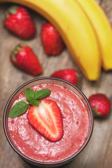 smoothie with banana and strawberry in the glass
