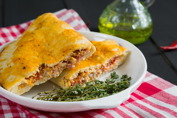 Pizza calzone with ham and cheese