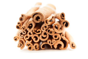 Top front view of Raw Organic Cinnamon sticks (Cinnamomum verum) bundle tied up with thread.