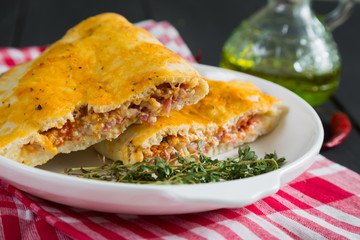 Pizza calzone with ham and cheese