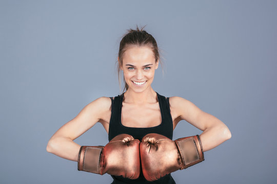 Beautiful sports girl with boxing gloves