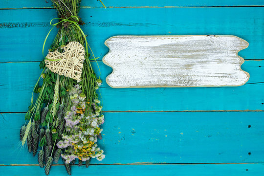 Blank Rustic Sign Hanging By Dried Flowers With Heart