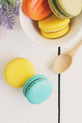 Colorful macaroons and a cup of coffee