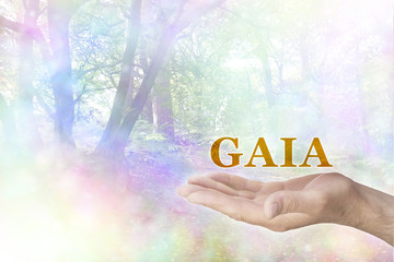 GAIA Philosophy - male hand palm up with a gold GAIA word floating above and a rainbow colored...