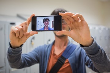 Student taking his selfie on smartphone