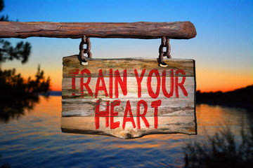 Fototapeta premium Train your heart motivational phrase sign