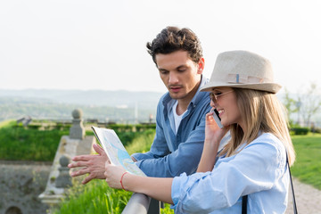 Tourists looking at city map