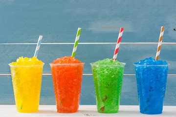 Colorful summer slushies. Blue background
