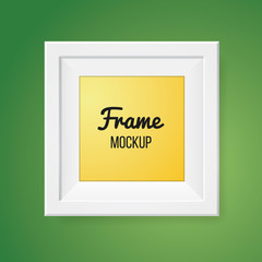 Blank frame template isolated on green wall.