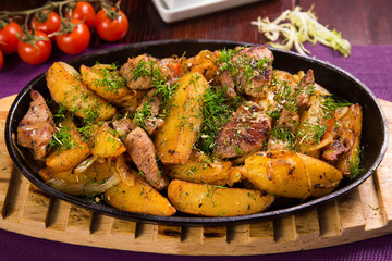 meat with potatoes in pen