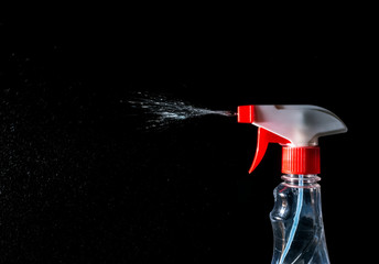 cleaner spray, stream of cleaner spray isolated on a black background
