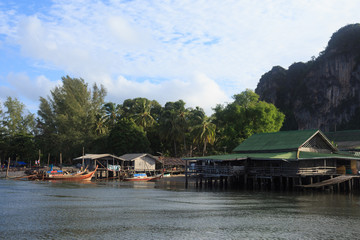 fisherman village and tradition floating home stand on a sea, Trang Thailand