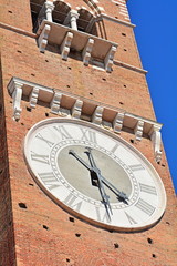 The medieval tower and the clock in Verona, the Torre dei Lamberti, Italy.