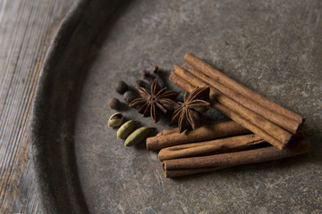 Spices on an old iron plate
