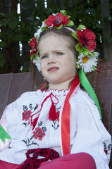 beautiful girl in traditional embroidered shirt jacket in the garden