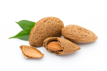 Almonds with leaves isolated on white background