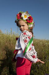 beautiful girl in traditional embroidered shirt jacket in the garden