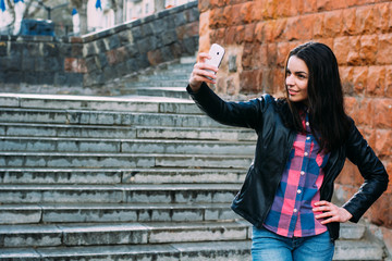 beautiful girl on the street makes selfie