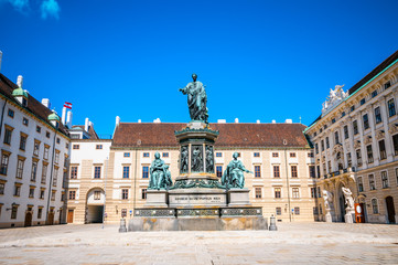 Fototapeta na wymiar Castle courtyard In der Burg and monument to Holy Roman Emperor Franz I in Vienna, Austria