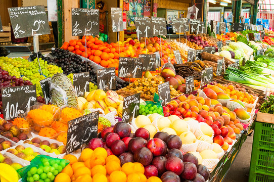 Vegetables and fruit at a farmers market stall. 
