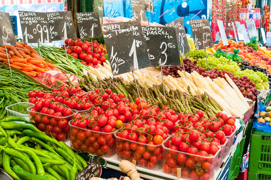 Vegetables and fruit at a farmers market stall. 